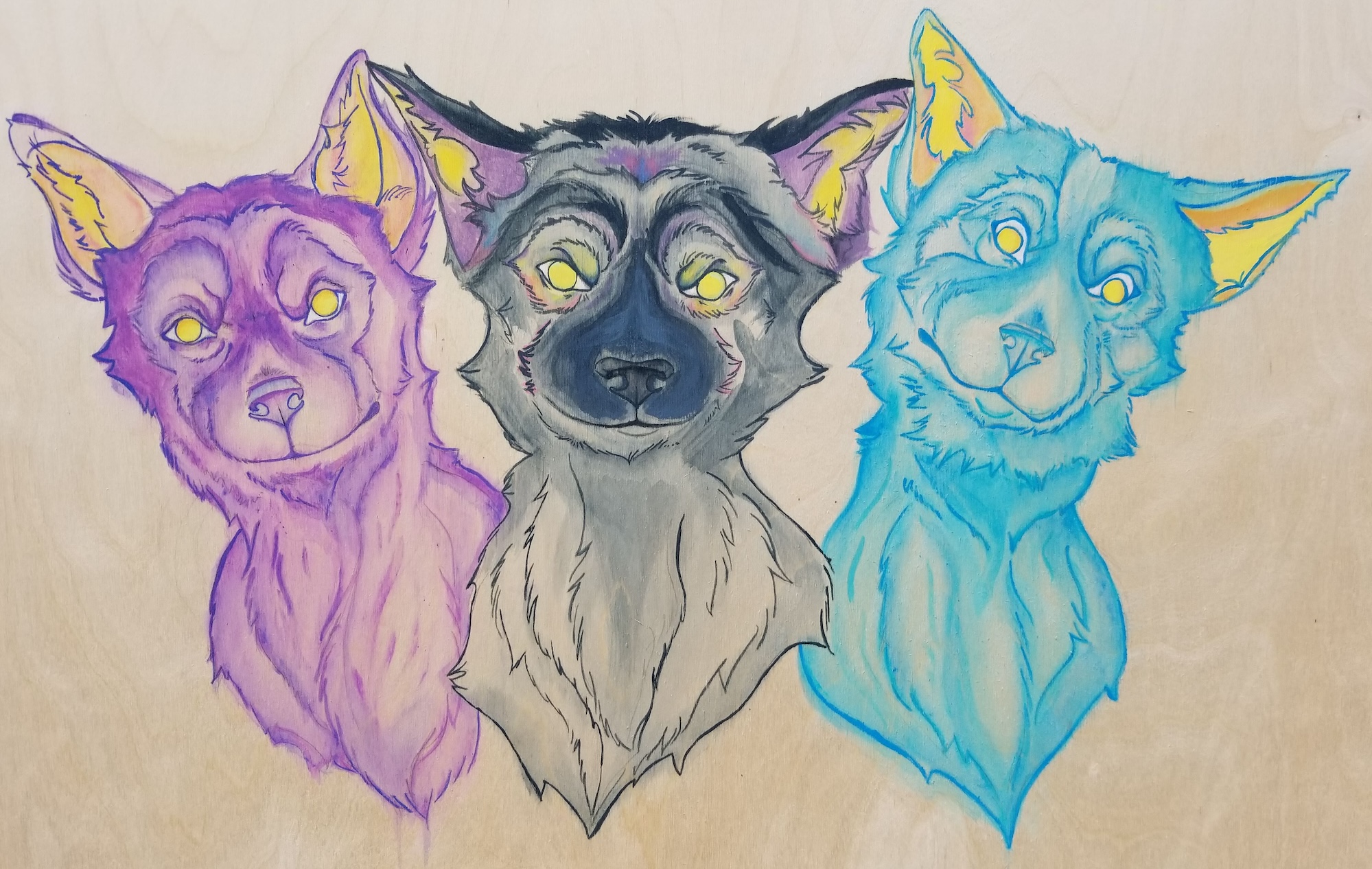 three dog heads painted in acrylic on plywood