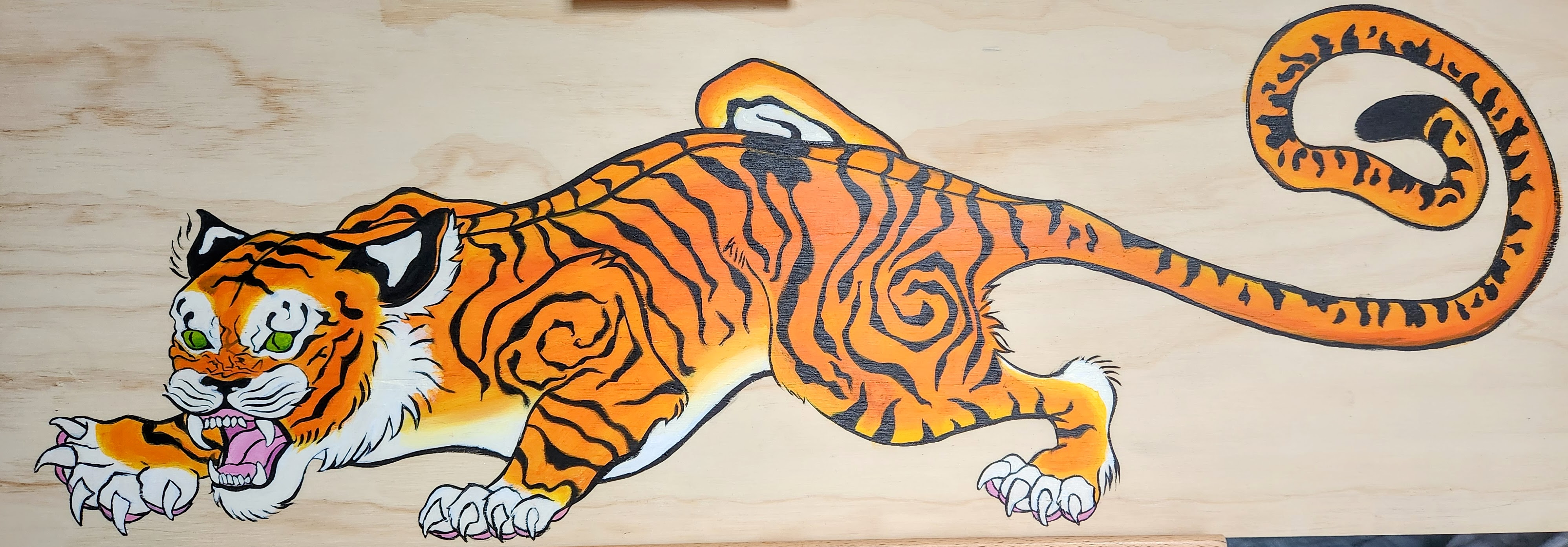 crawling tiger painted in acrylic on plywood